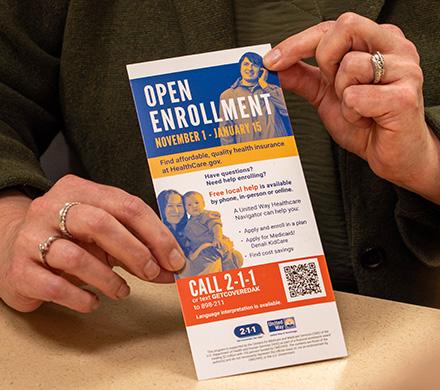 A healthcare navigator shows an Alaskan information about open enrollment.