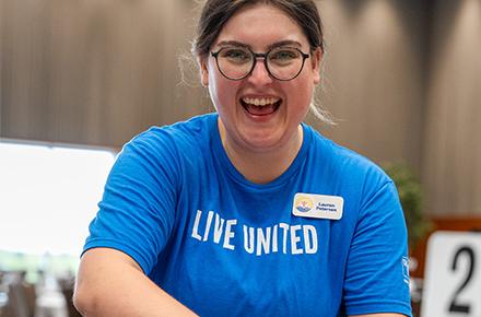 Lauren Petersen, our Communications & Engagement Coordinator, helping with Community Campaign Kickoff 2025.