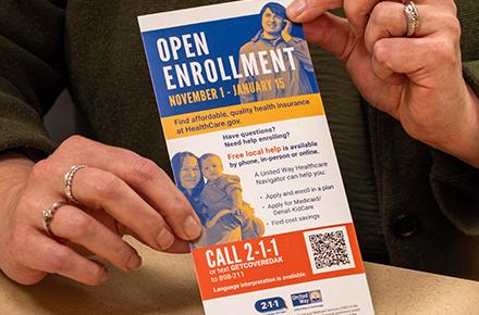 A healthcare navigator shows an Alaskan information about open enrollment.