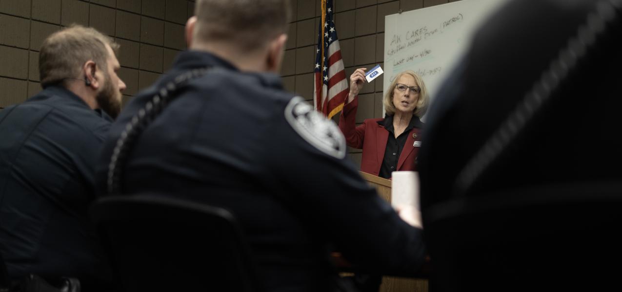 Persons showing a 211 call card during a presentation to a police force