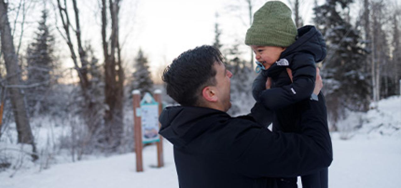 A father and son enjoy each other's company on an Anchorage trail system in the early part of 2025.