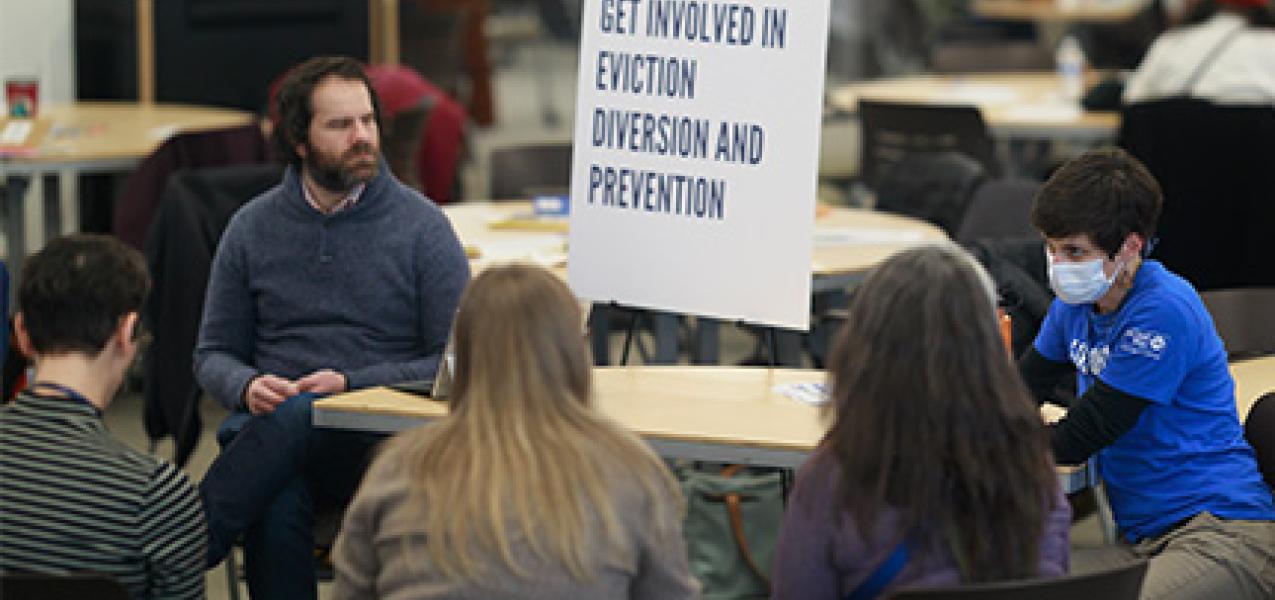 United Way of Anchorage staff and community members who are involved in eviction diversion efforts meet at a symposium in March 2025.