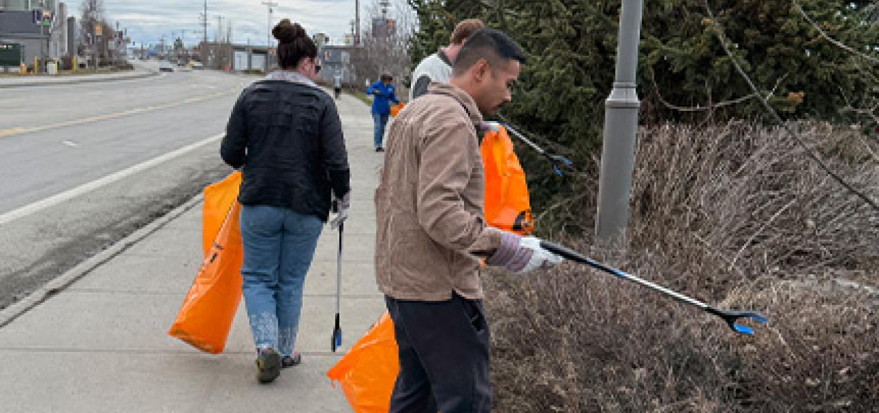 United Way of Anchorage employees pick up trash in Mountain View on May 8, 2026.
