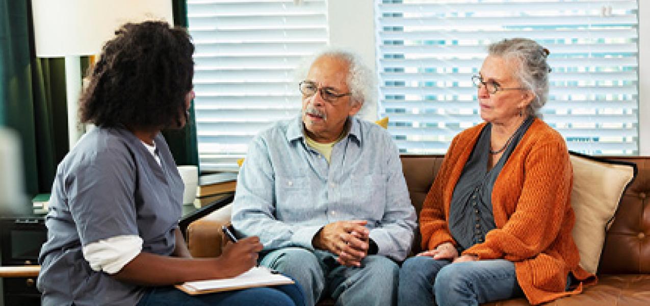 A couple evaluates their options with a health care provider.