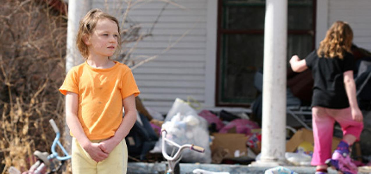 Children in an ALICE household play outside, unaware that they're also impacted by being below the poverty-level threshold.