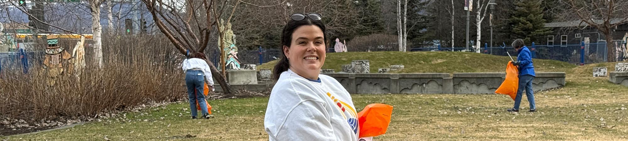 United Way of Anchorage employees pick up trash in the green space on our property on May 8, 2026.