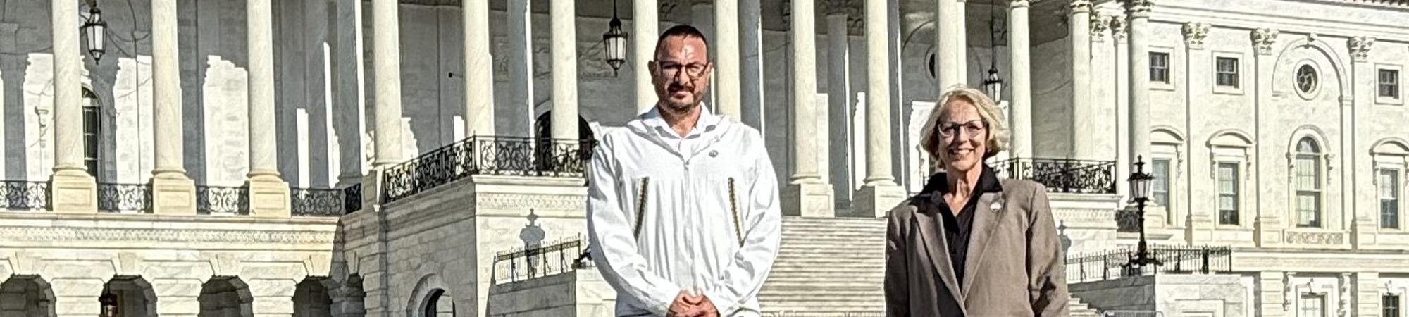 Eric Billingsley and Sue Brogan stand outside the U.S. Capital in May 2026.