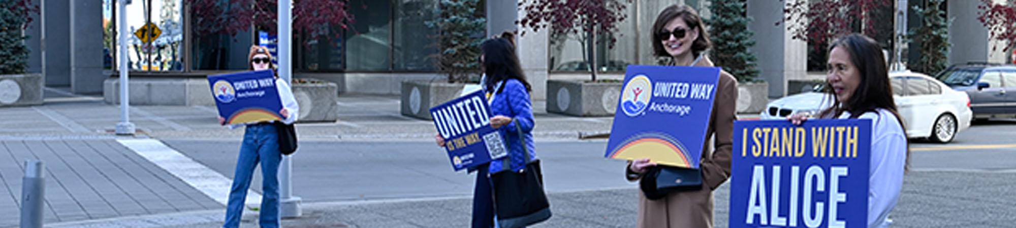 United Way of Anchorage employees participate in a positive picket for the launch of our 2026 ALICE in Alaska report.