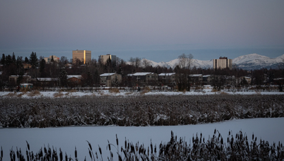 Photo by Matt Faubion/Alaska Public Media: Downtown Anchorage as seen from Westchester Lagoon on Dec. 7, 2025.