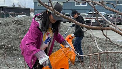 United Way of Anchorage employees pick up trash from our parking lot on May 8, 2026.