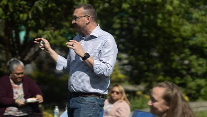 Eric Billingsley talks to United Way employees on a nice summer day.