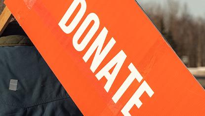 An Anchorage community member encourages people to donate to United Way..